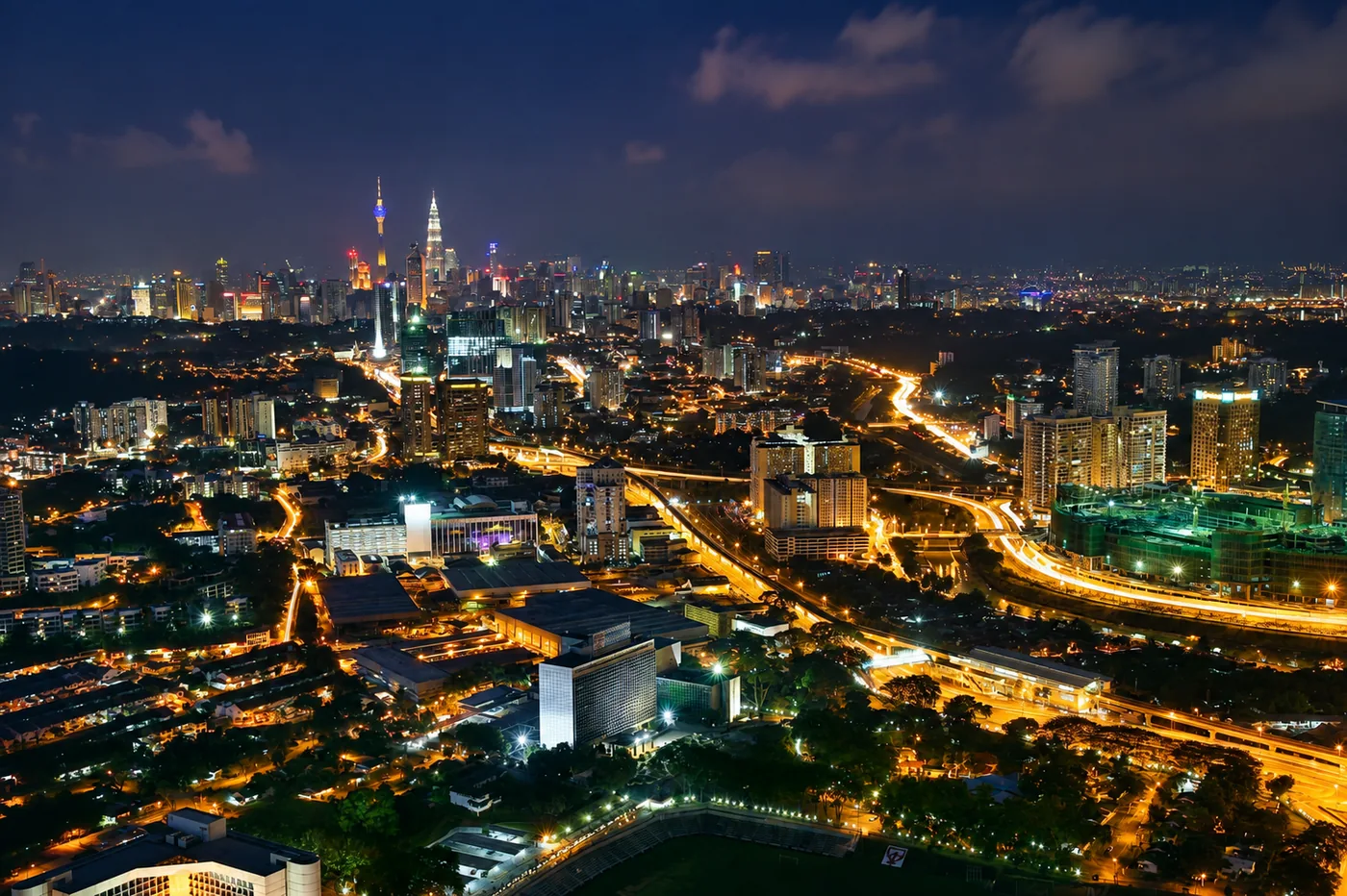 Kuala Lumpur skyline at night with expressways near Parc Residences
